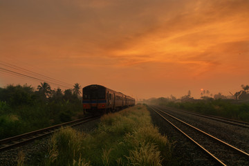 Train Passing by over Rural Railway in the Morning or at Dawn wi