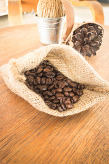 Coffee roasted bean on wooden table vintage style