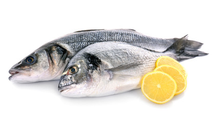 Fresh fish with lemon isolated on white background