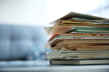 Pile of old books on white table