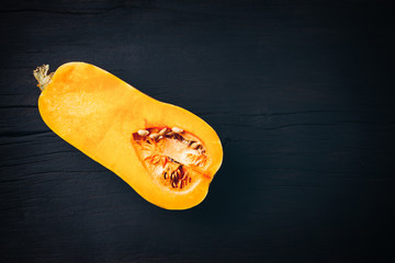 Yellow zucchini on wood