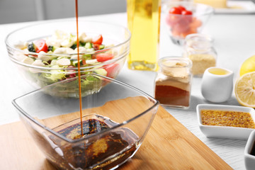 Process of preparing sauce for salad, at kitchen