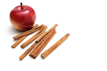 Red apple and cinnamon sticks