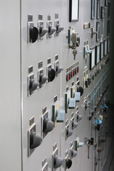 Old power plant control panel with switches and instruments