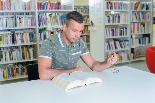 Man reading in library