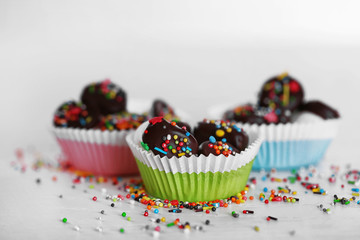 Tasty marshmallows with chocolate in cups on table, close up