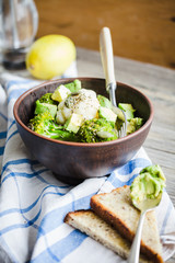 healthy vegetable salad with broccoli, cauliflower, avocados, pu