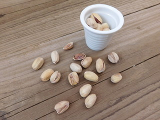 pistachios to eat on wooden base