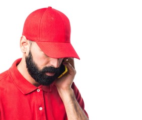 Pizza delivery man talking to mobile