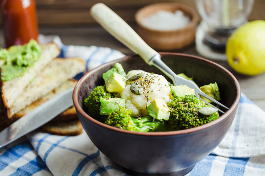 Winter vegetable salad with broccoli and cauliflower, toast with