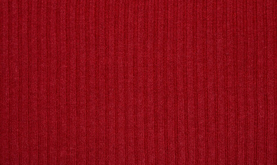 Red knitted sweater texture, background