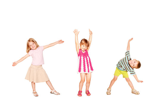 Funny little kids dancing. Isolated on white