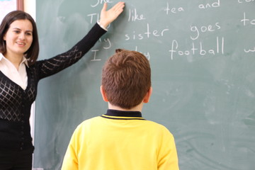 the  turkish teacher tells the students english lesson in the class.