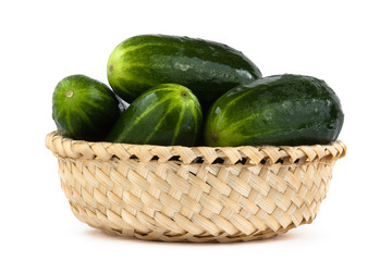 cucumbers in basket on white background
