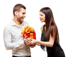 Young beautiful couple with present isolated on white