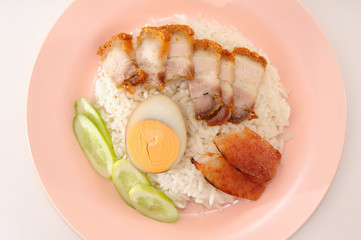 Crispy pork rice and half of egg with sauce