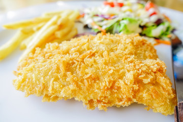 chicken chop, French fries and vegetables