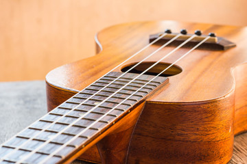 Fototapeta premium Close up of ukulele on table