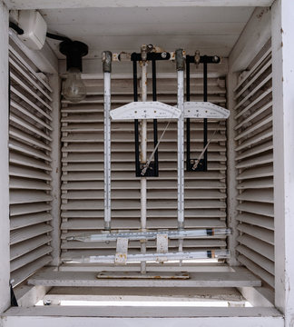 Weather station. Psychrometric booth with recorders - hygrographs and thermography. Various instruments for meteorological measurements, weather observation