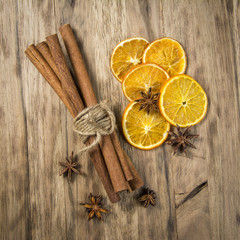 cinnamon sticks and anise stars on wooden table