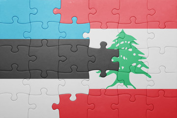 Fototapeta premium puzzle with the national flag of estonia and lebanon
