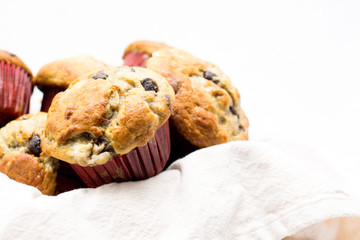 chocolate chips muffins on a white background