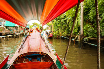 Fototapeta premium Trip through Bangkok canals down the Chao Phraya river on longtail boat