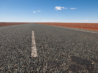 Australia, Outback, 09/10/2015, Long outback australian road with a beautiful blue sky disappearing into the horizon