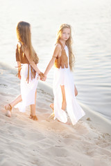 Fototapeta na wymiar portrait of two girls of girlfriends on a summer nature