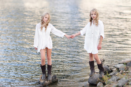 portrait of two girls of girlfriends on a summer nature