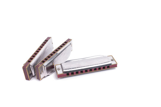 harmonicas,  french harps or mouth organs isolated on white back