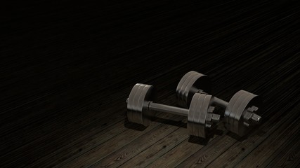 Dumbells on a wood floor with black background.