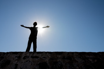 Silhouette of Young Man on High Place