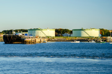 Oil Tanks by the Harbour at Sunset