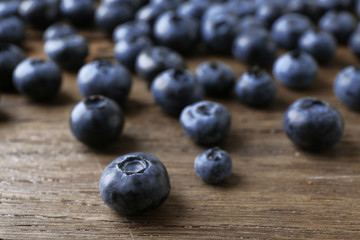 Fresh blueberries on wooden table, closeup