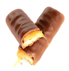 Tasty broken chocolate bars isolated on white background