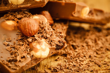 chocolate shavings and pieces on wooden table