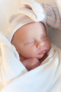 Newborn baby girl sleeping close up
