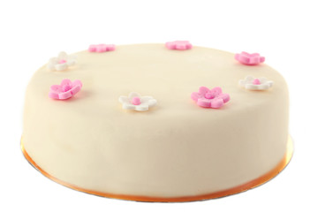 Cake with sugar paste flowers, isolated on white