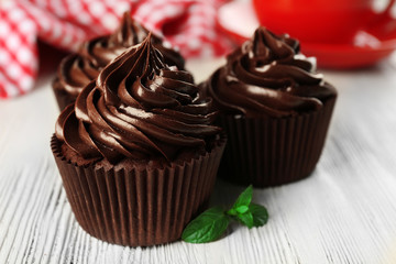 Cupcakes served with a drink on table