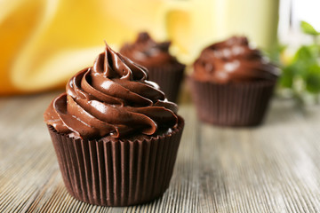 Chocolate cupcakes with drink on table