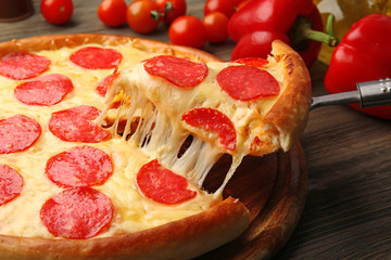 Hot tasty pizza with salami, close up