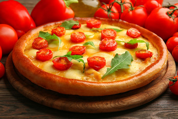 Pizza Margherita with arugula, red pepper, tomatoes, close-up
