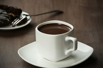 Cacao with biscuits on wooden table