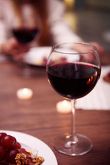 Glass with red wine on the table