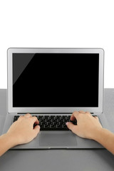 Fototapeta premium Female hands working on laptop, on light background