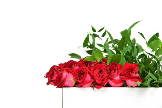 Modern red roses and green leafs bouquet composition with text c