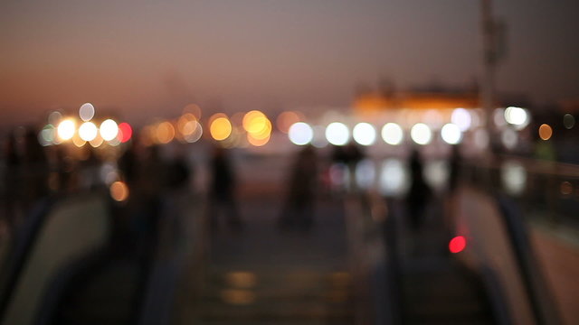 Out of focus background and unrecognizable people walking around pier Kadikoy,Istanbul 