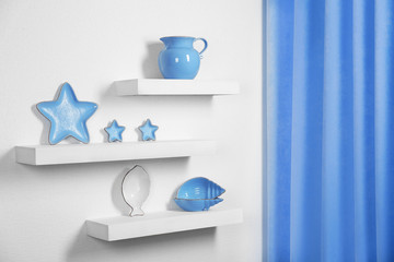 New blue dish on a shelves in room