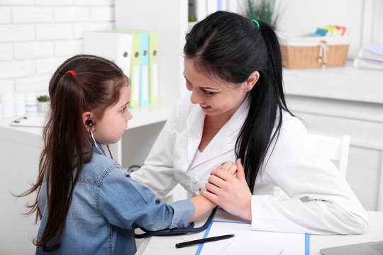 Child examining the doctor in the office